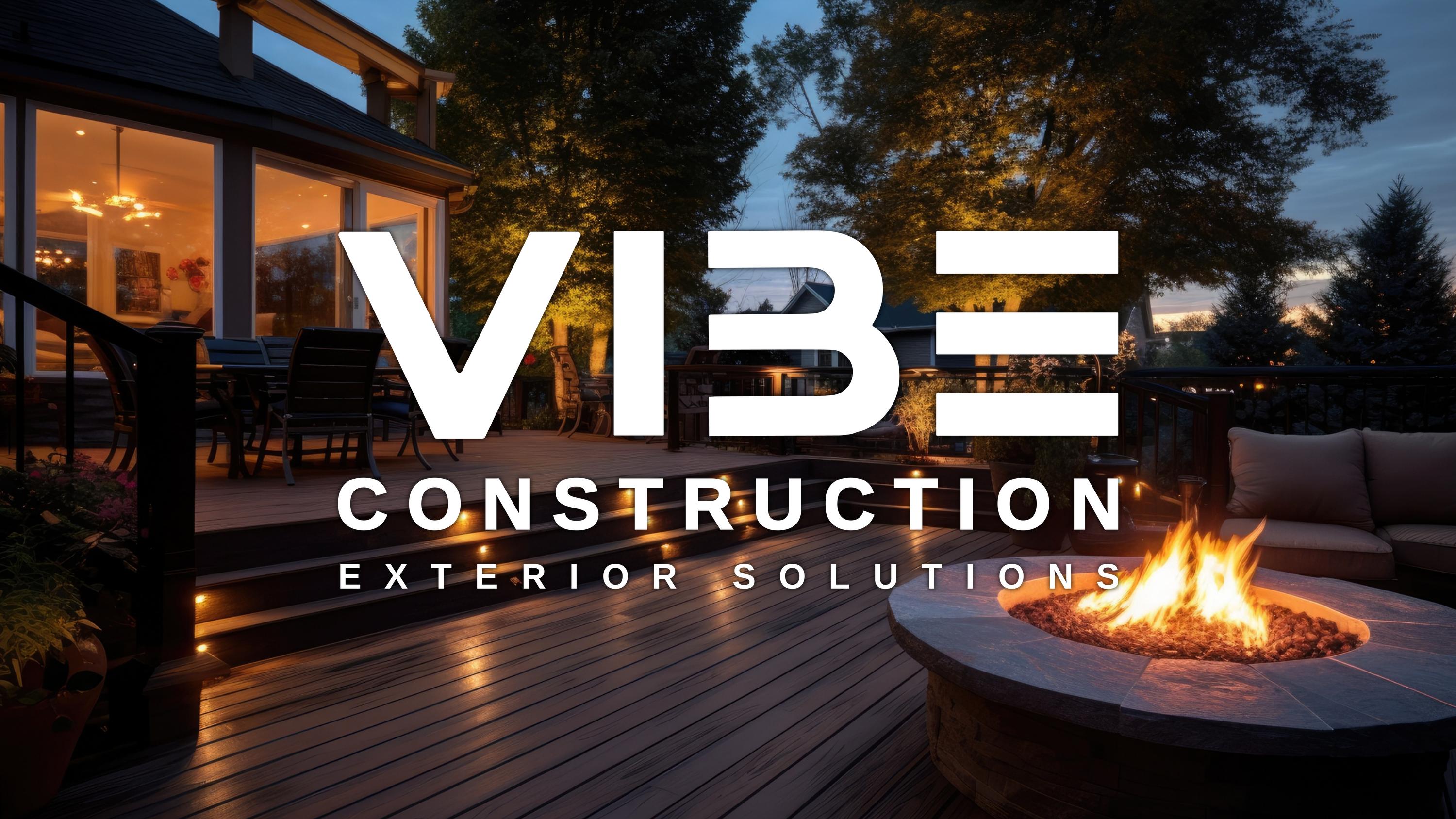 Vibe Construction branded deck and exterior living space at dusk
